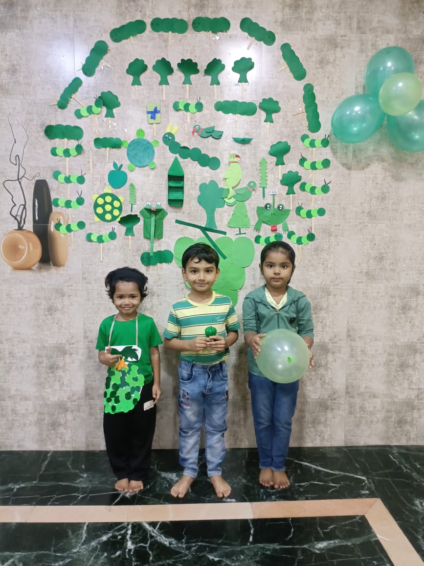 Children celebrating Green Day with eco-friendly costumes and activities